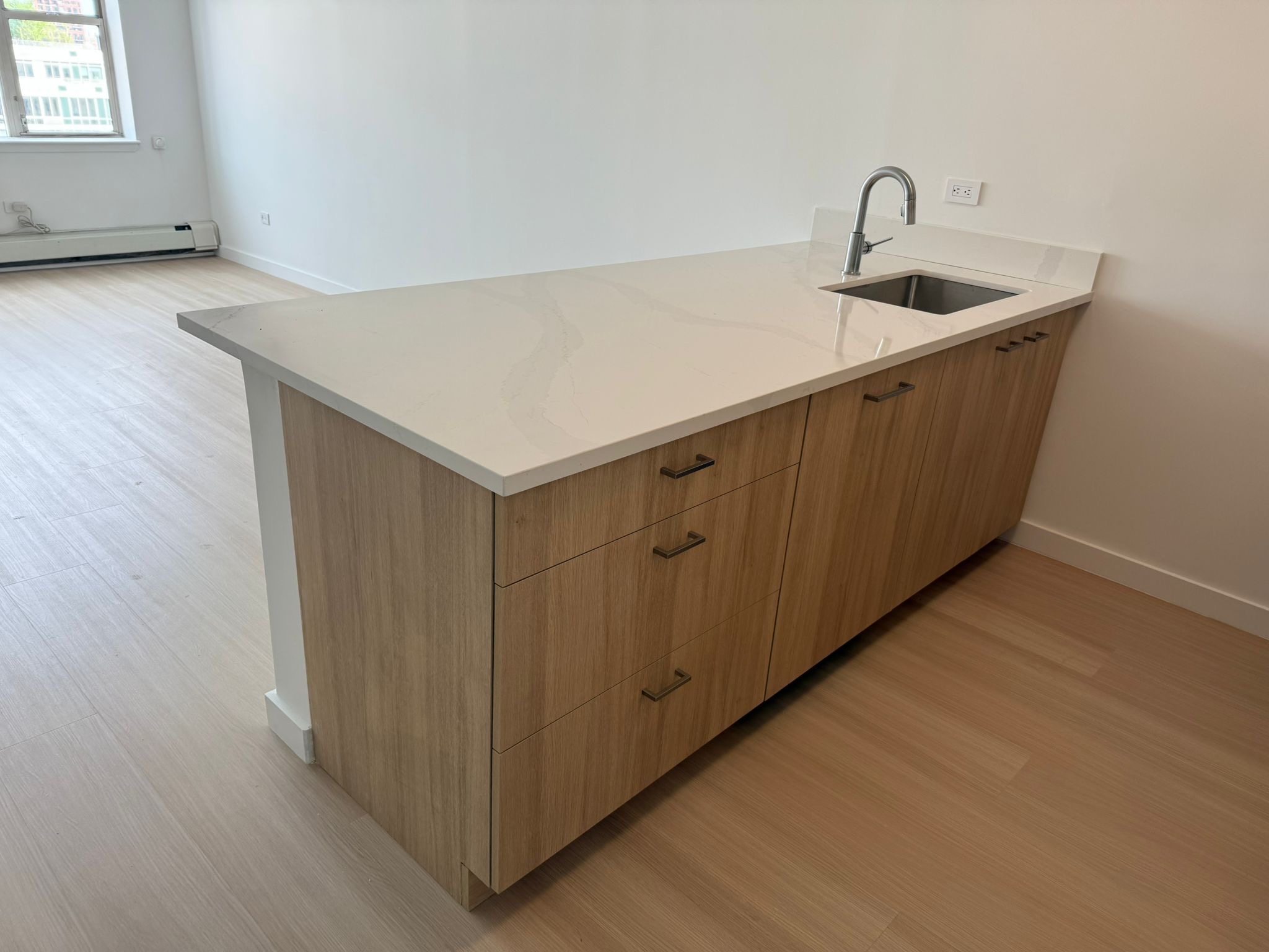 Kitchen island with wood cabinets and quartz countertop — AV Woodmark NYC